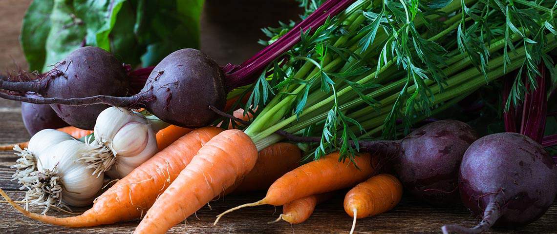 Fresh carrots, garlic, beets and various other vegetables.